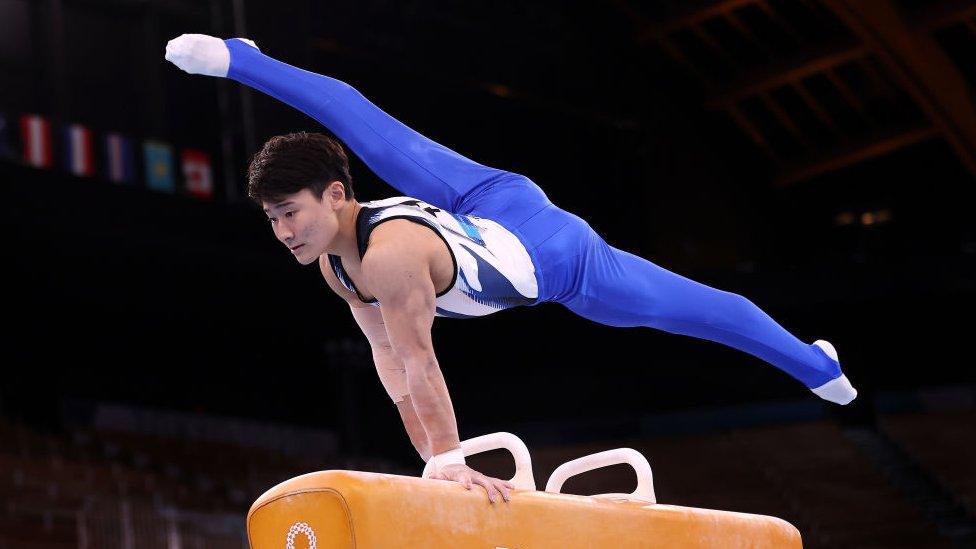 Takero Kitazono of Team Japan competing on the pommel horse at the Tokyo Olympics