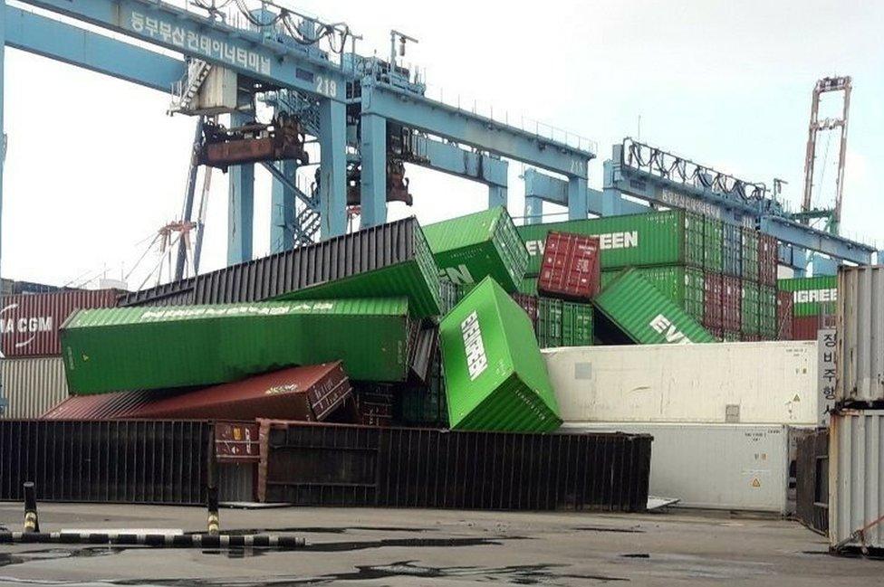 Containers lie in a heap after being blown over by Typhoon Maysak at a pier in Busan, South Jeolla Province, South Korea, 03 September 2020.