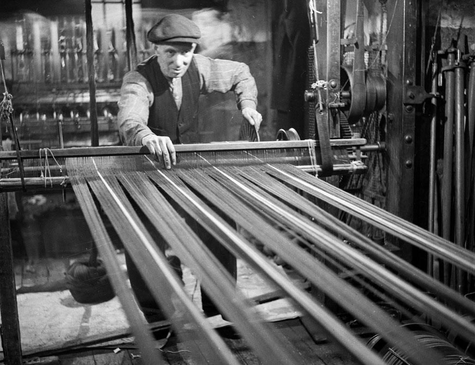 A worker on a loom in 1952