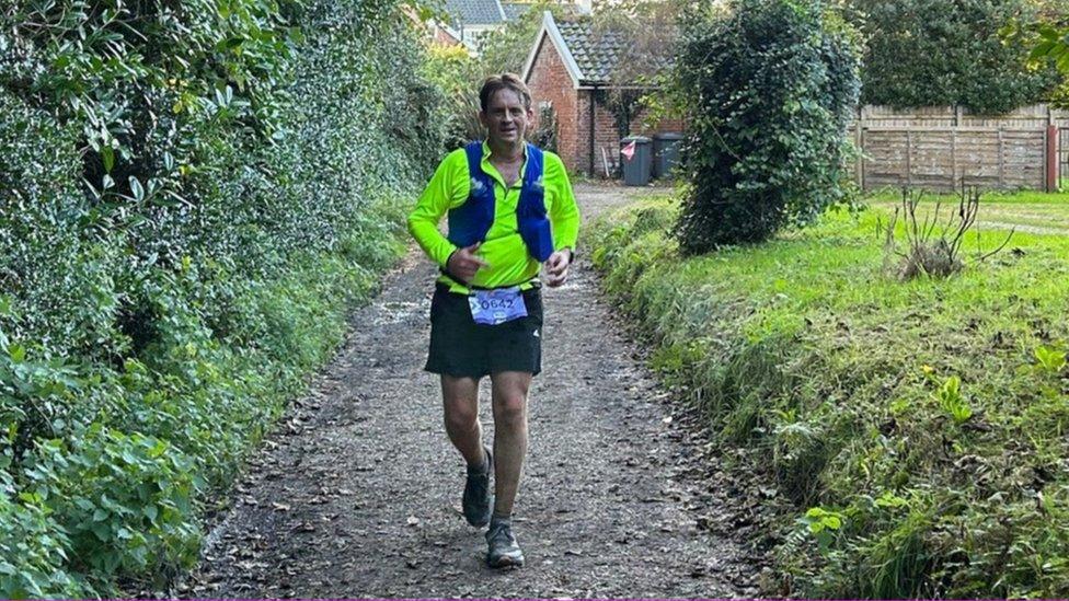 Hugh Langley running in the triathlon