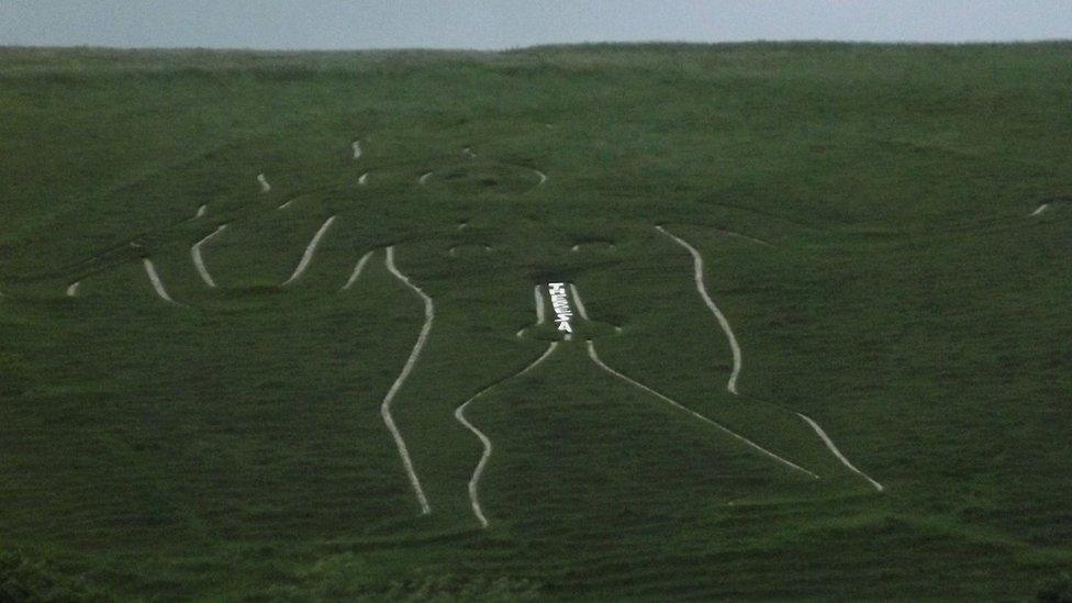 Cerne Giant with Theresa graffiti