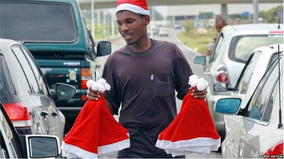 A vendor sells hats in Johannesburg