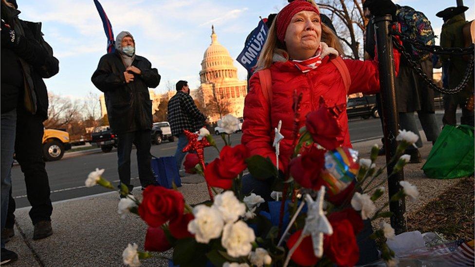 A woman cries at a makeshift memorial to Babbitt in Washington, where she died