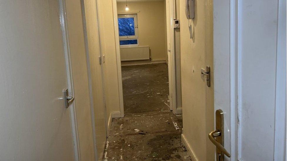 View from front door showing floorboards and empty property