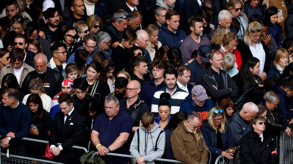 Mourners in London mark the two-minute silence