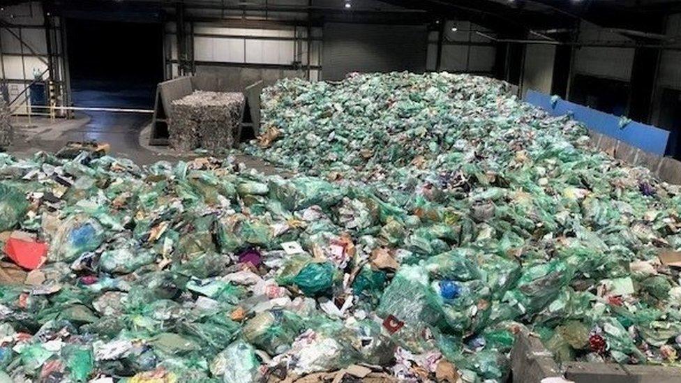 Green bags filled with recycling at Cardiff waste centre