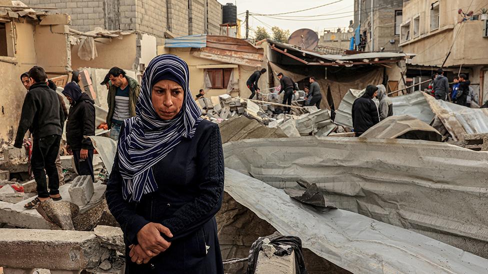 Palestinians check a destroyed building following Israeli strikes in Rafah on Wednesday