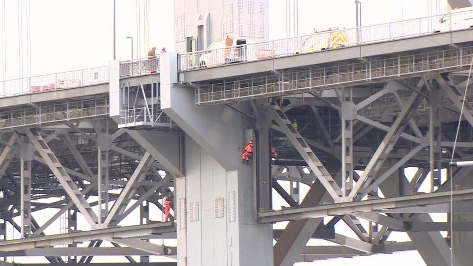 Workers on bridge