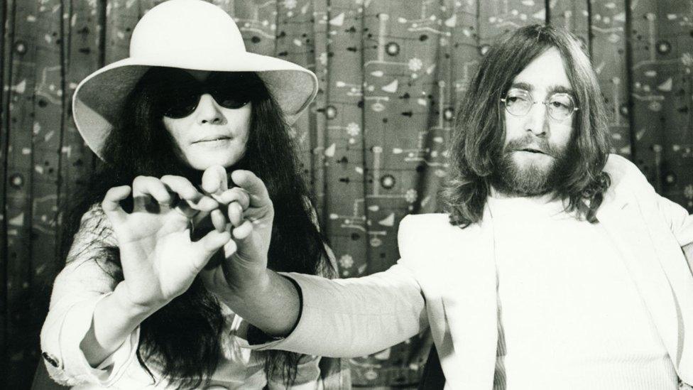 John Lennon and Yoko Ono with acorns