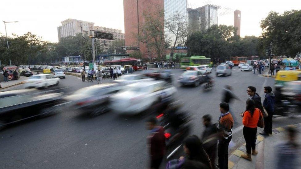 Vehicles drive on a road before the implementation of the odd-even vehicle scheme in New Delhi, India, 30 December 2015.