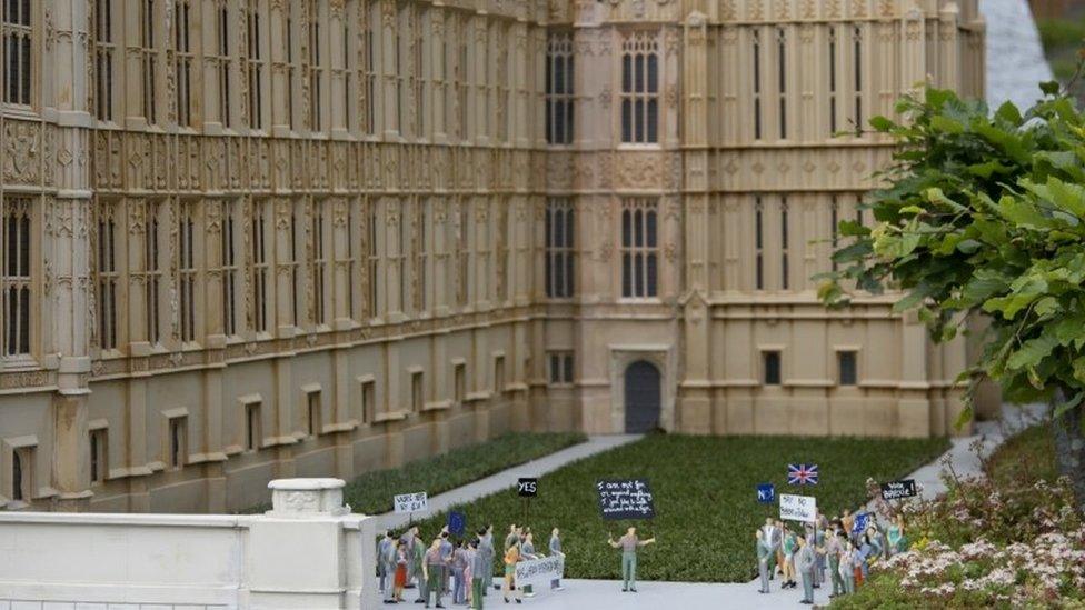 Miniature models depict both sides of the British EU debate during a demonstration in front of a miniature London's houses of parliament at the Mini-Europe park in Brussels