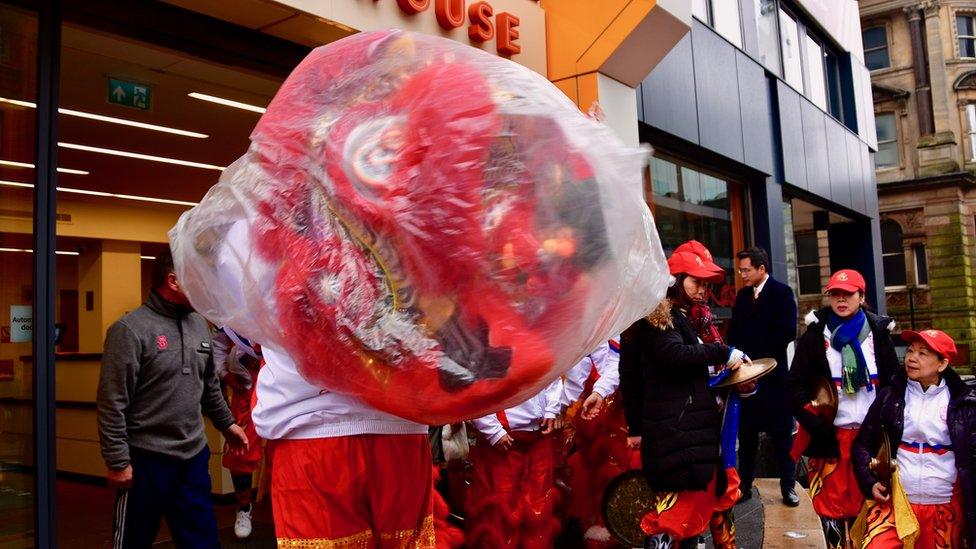 A Chinese lion head protected from rain