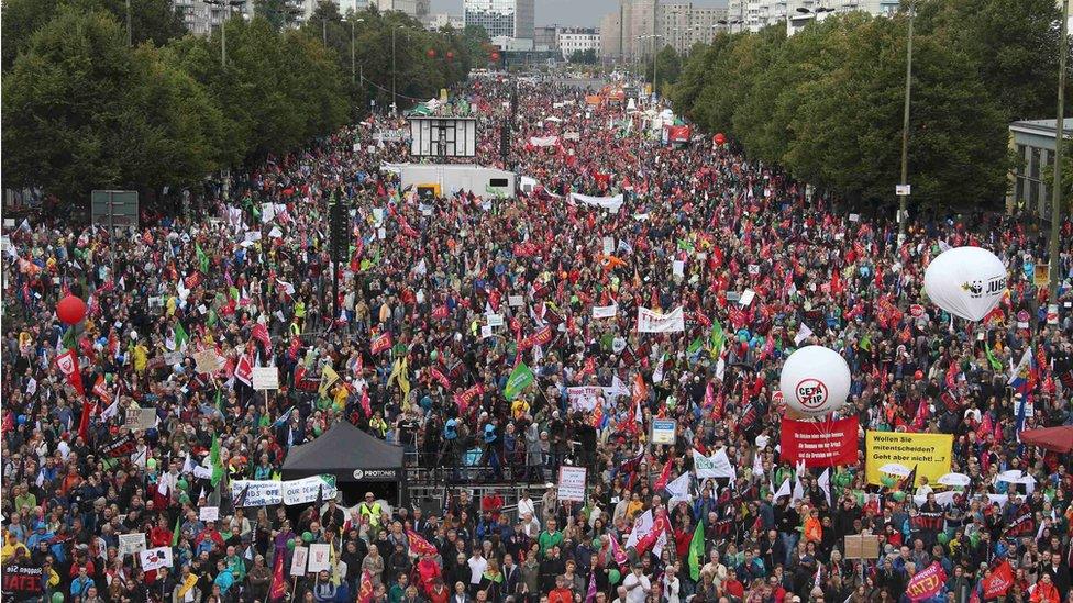 Consumer rights activists take part in a march to protest against the Transatlantic Trade and Investment Partnership (TTIP) and Comprehensive Economic and Trade Agreement (CETA) in Berlin, Germany, 17 September, 2016.