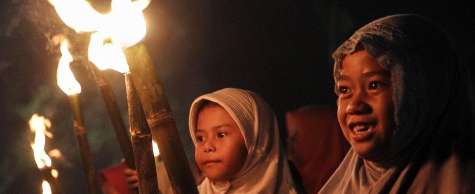 Indonesian Muslims seen carrying torches as they take part in the commemoration of the Islamic New Year, on October 01, 2016