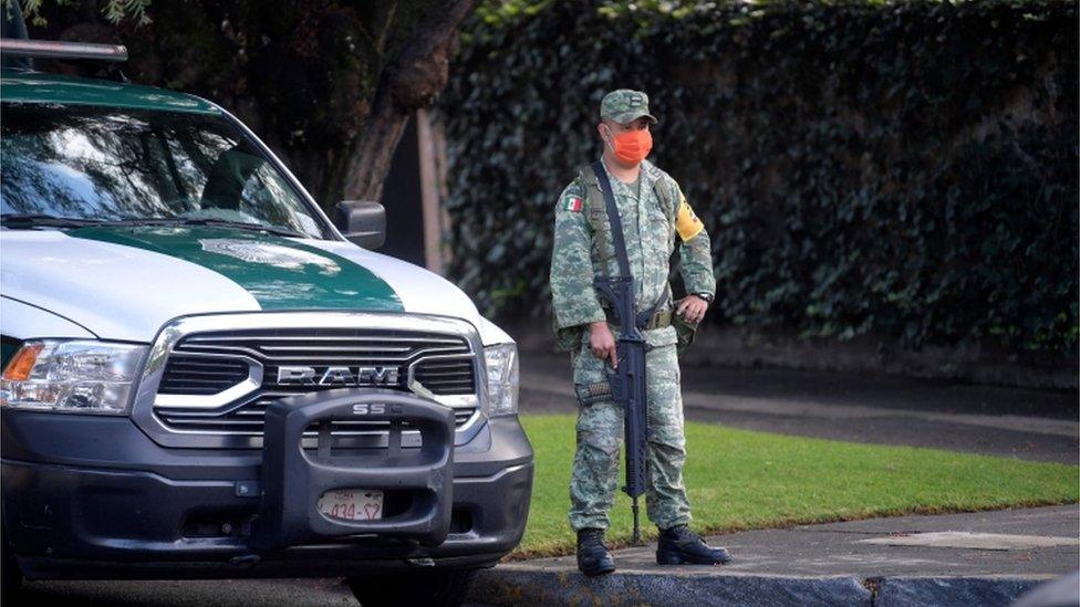 A soldier stands guard after Mexico City's Public Security Secretary Omar Garcia Harfuch was wounded in an attacked in Mexico City, on June 26, 2020