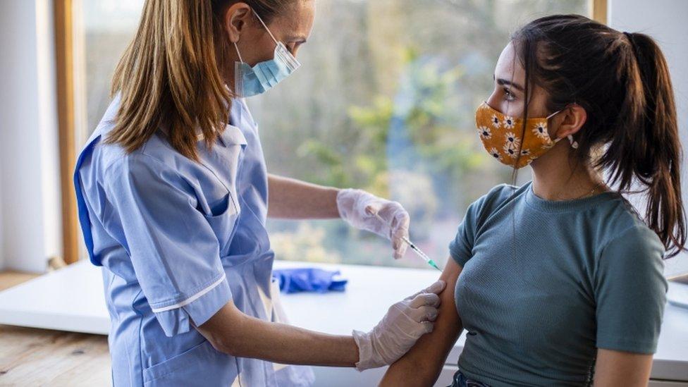 A Covid vaccine being given