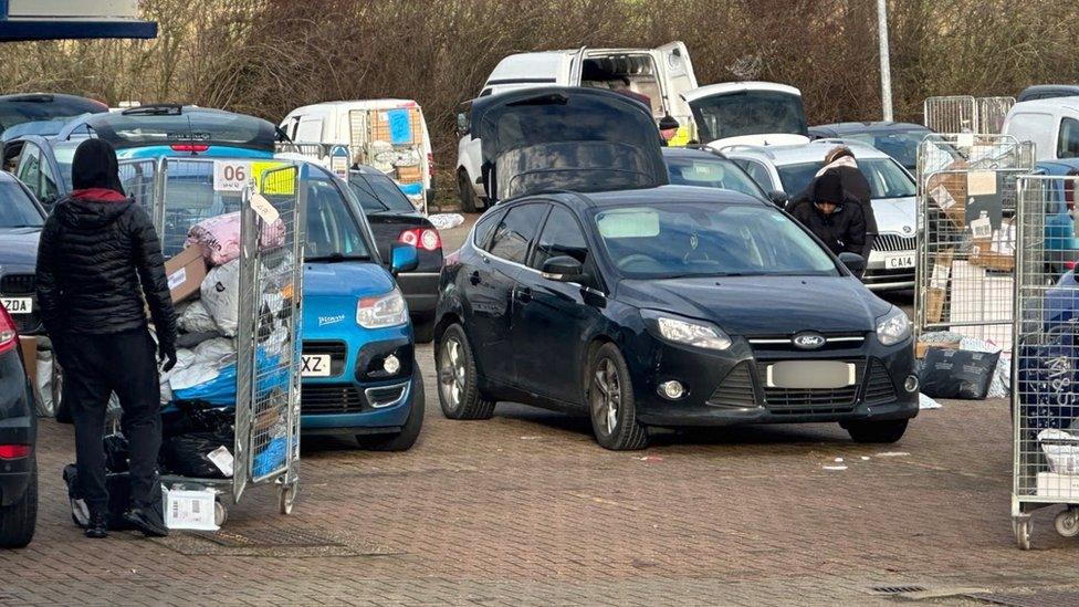 Boots of cars at the depot are open for parcels