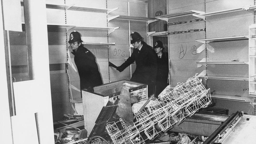 Police survey damage after riots