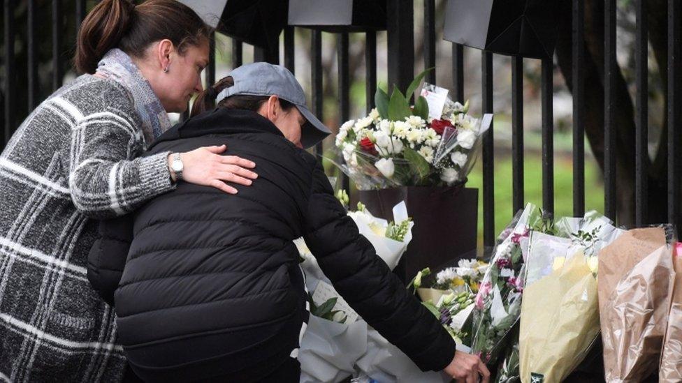 People pay tribute to the three boys