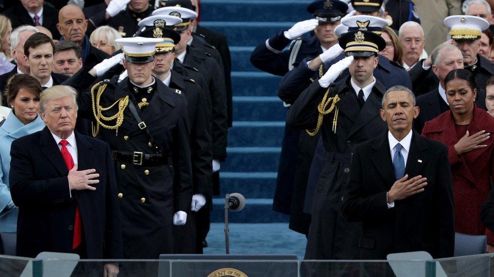 President Donald Trump and former president Barack Obama place their hands on their hearts during the national anthem on the West Front of the U.S. Capitol on January 20, 2017 in Washington, DC.