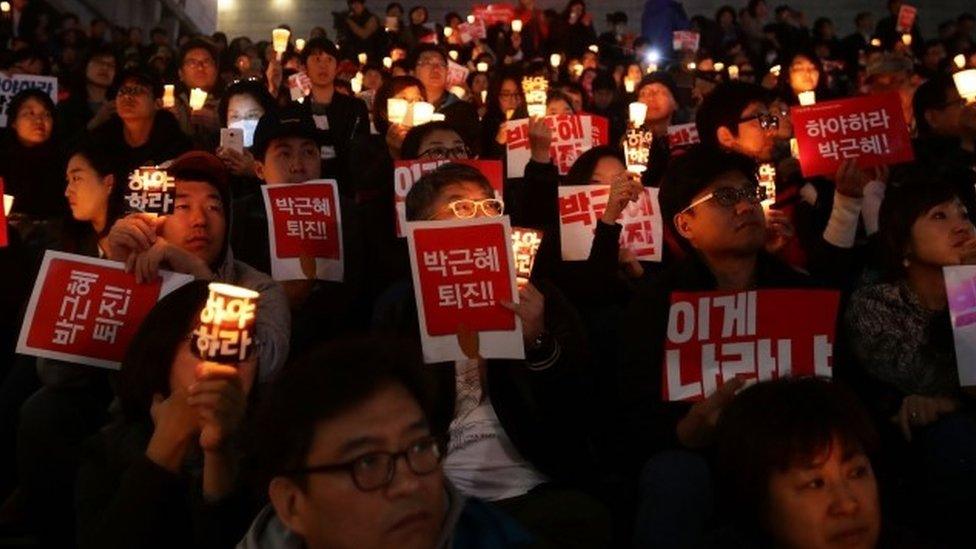 Protesters chanted, sang and held banners