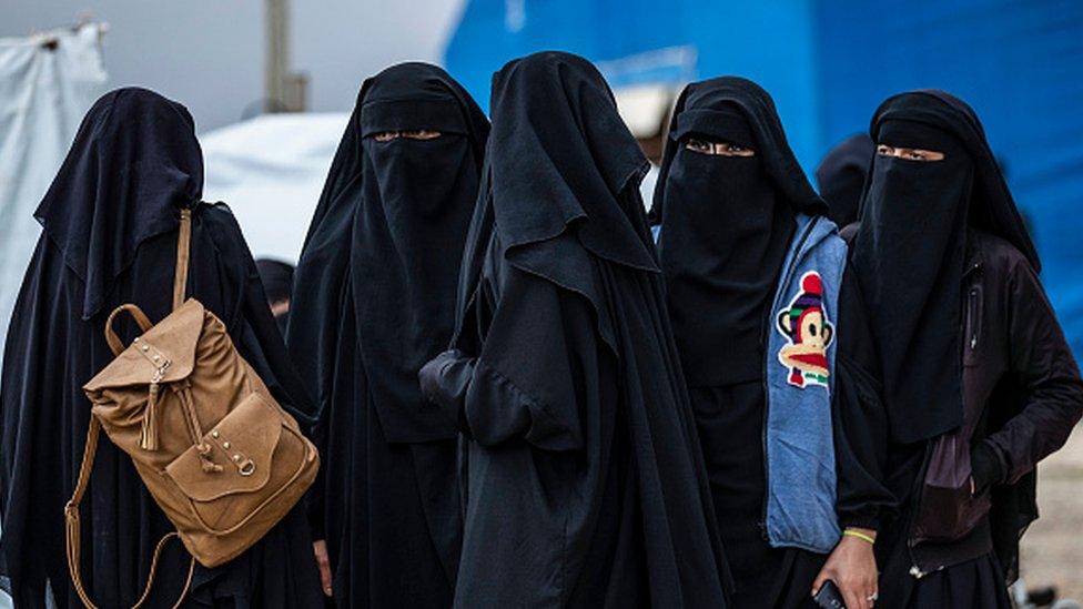 Syrian women get ready to leave the Kurdish-run al-Hol camp holding relatives of alleged Islamic State (IS) group fighters