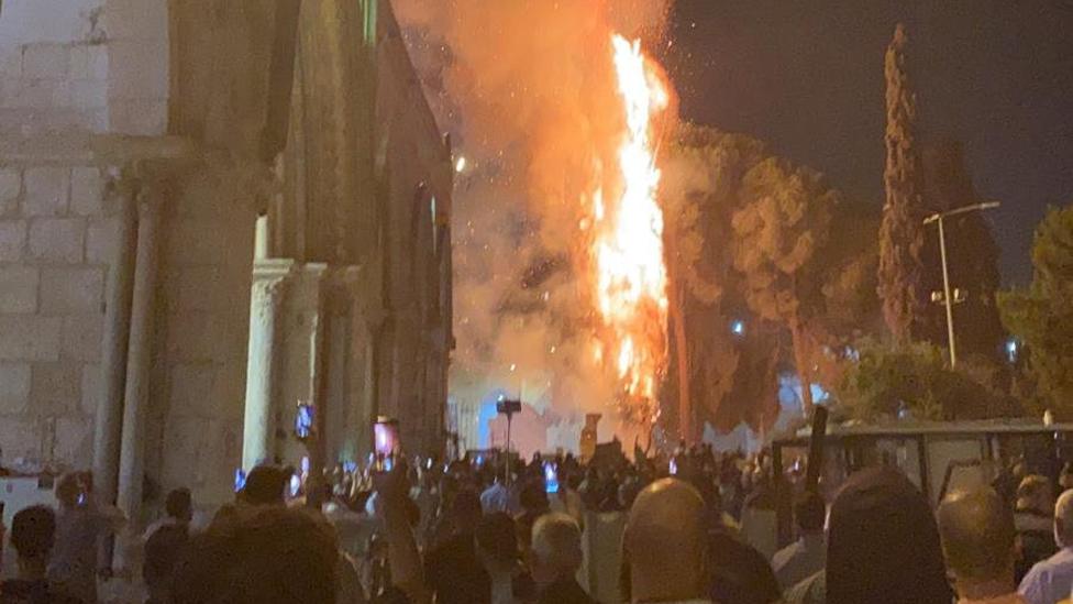 A tree set on fire at the Al-Aqsa mosque