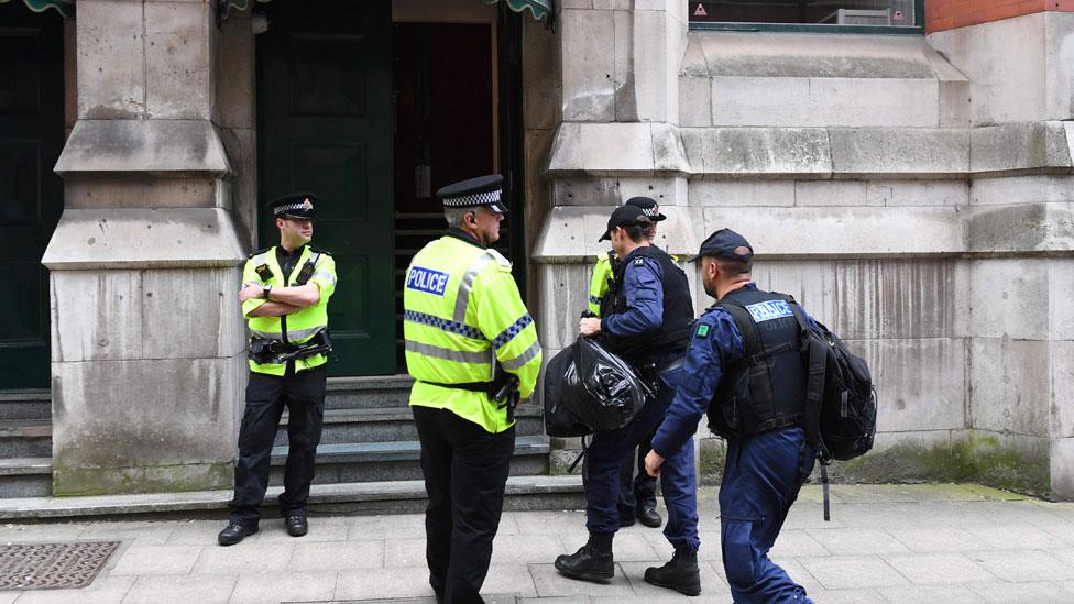 Police during a search of an address in Manchester