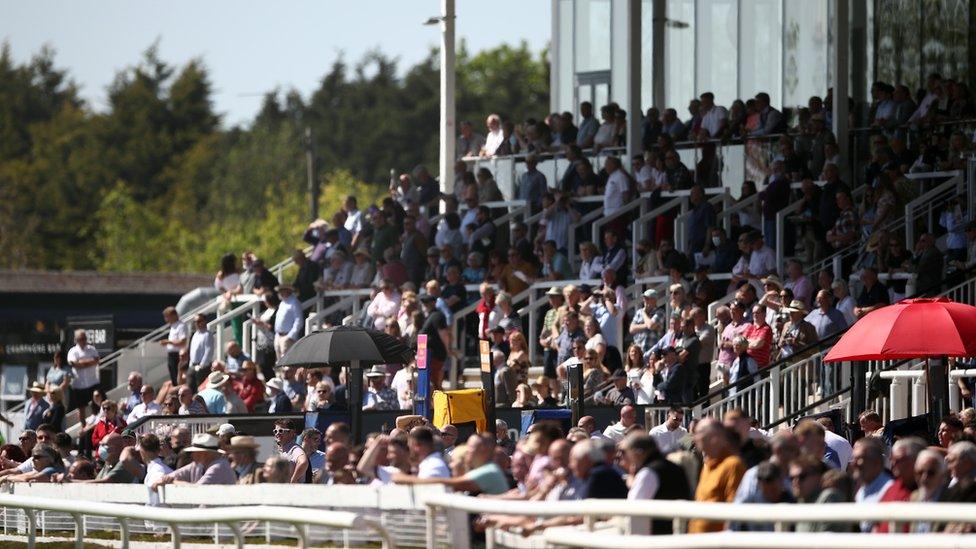 Racegoers enjoy the sunny weather at Uttoxeter Racecourse on Sunday