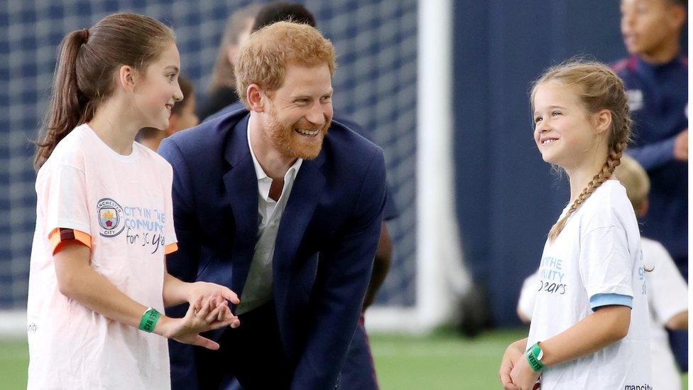 Prince Harry at junior soccer coaching in Manchester