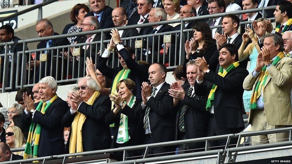 Norwich City directors stand and applaud