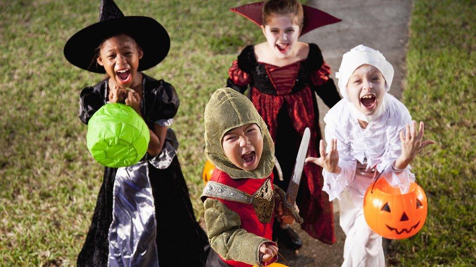 Children trick or treating.