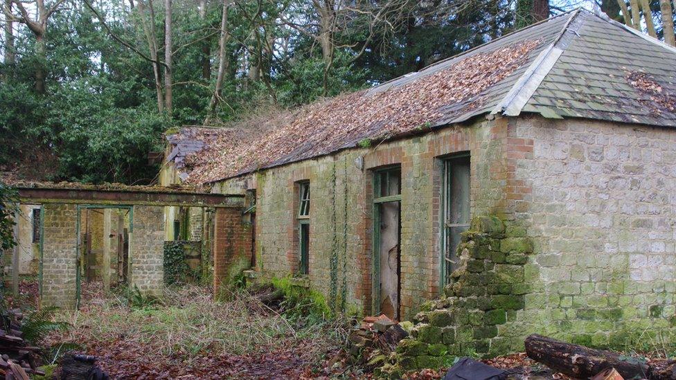 A derelict stable block