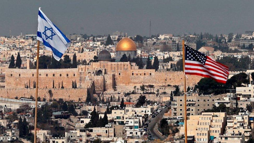 Israeli and US flags over Jerusalem