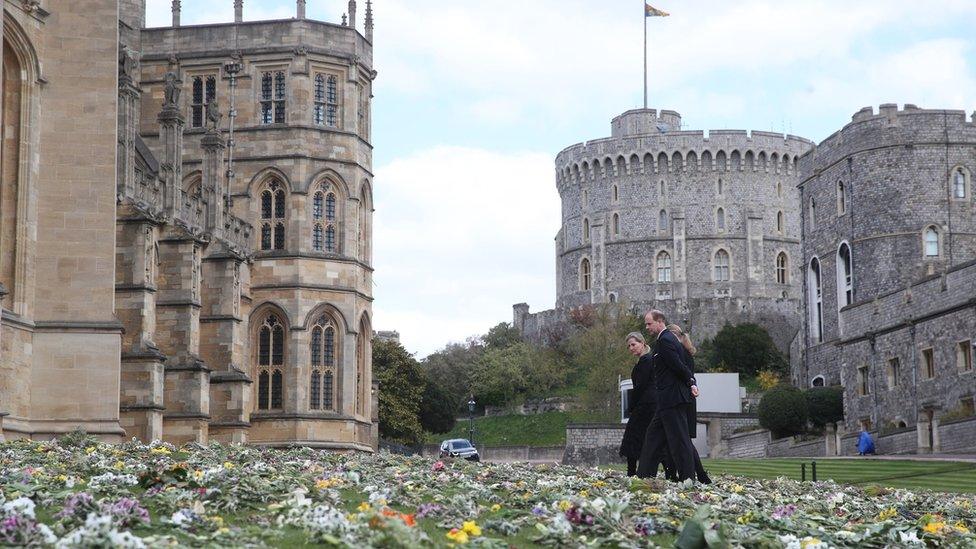 The Countess of Wessex, Lady Louise Windsor and the Earl of Wessex view flowers outside St George's Chapel, at Windsor Castle, on 16 April 2021