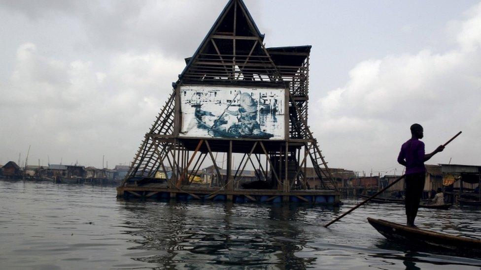 In photo released 4 March 2016, the Makoko floating school is seen anchored in the Lagos Lagoon, Nigeria February 29, 2016.In Makoko, a sprawling slum of Nigeria"s megacity Lagos, a floating school capable of holding up to a hundred pupils has since November brought free education to the waterways known as the Venice of Lagos. It offers the chance of social mobility for youngsters who, like most of the city"s 21 million inhabitants, lack a reliable electricity and water supply and whose water-based way of life is threatened by climate change as well as rapid urbanisation.