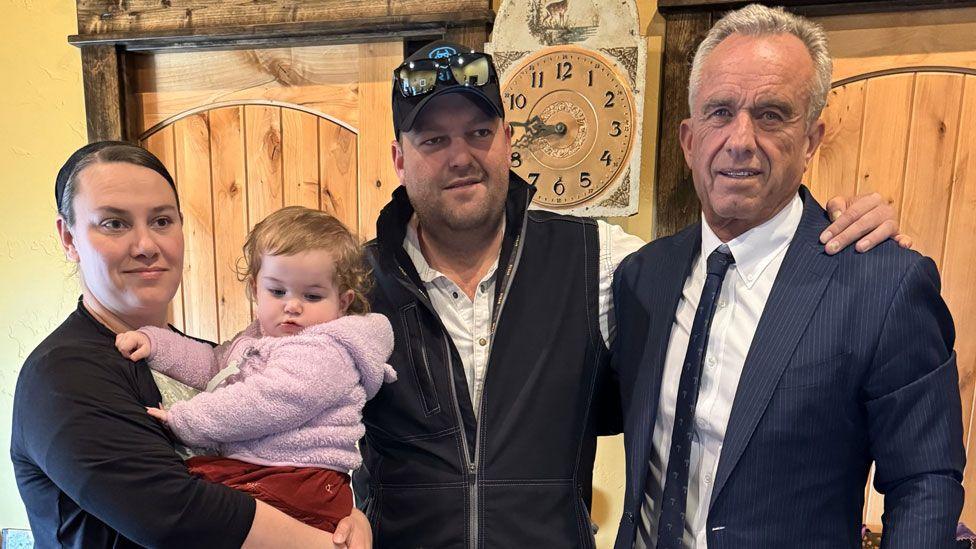 Robert F Kennedy Jr poses with members of Texas's Mennonite community