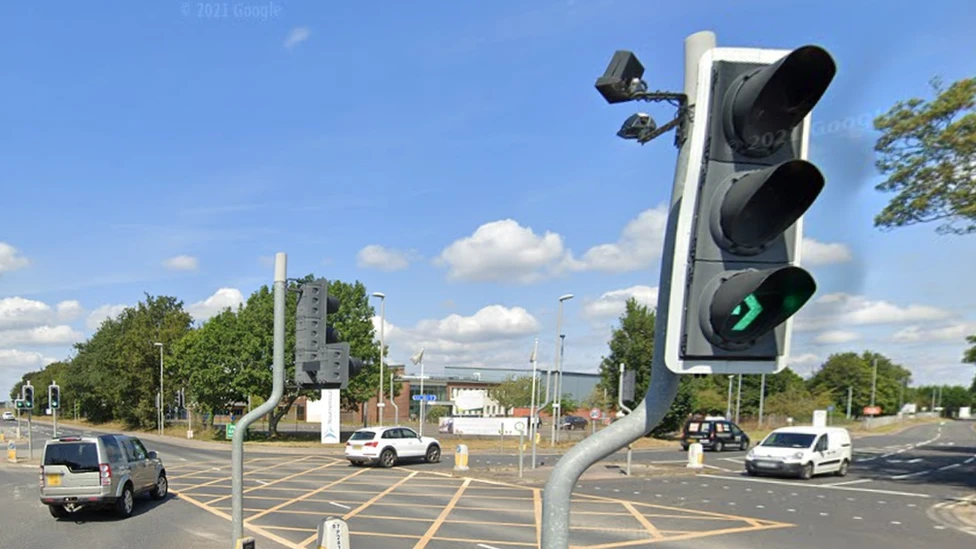 A general view of Parley Lane in Hurn at its junction with Hurn Court Lane. It is a road with two lanes on either side, with traffic lights situated at the entrance of each road 