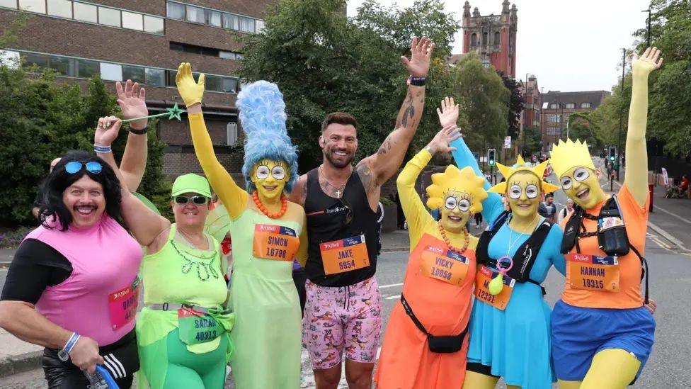 Reality star Jake Quickenden is joined by people dressed up as The Simpsons.