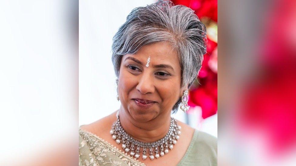A head and shoulders picture of Nila Patel wearing silver jewellery round her neck and on the centre of her brow. 