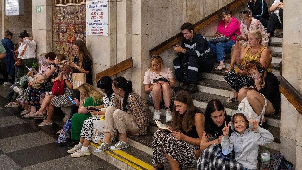 People take shelter from shelling at a metro station in Kyiv, Ukraine, 