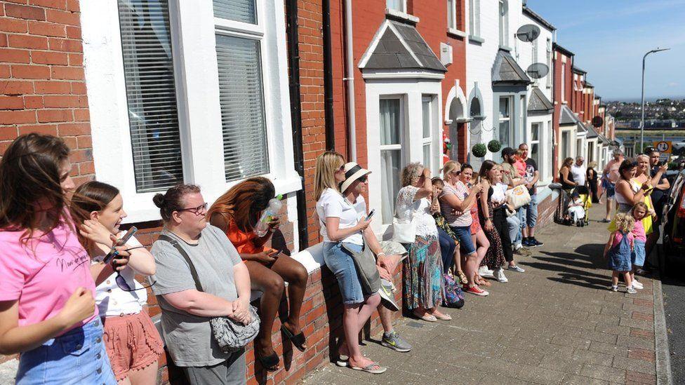 Crowds watching the filming