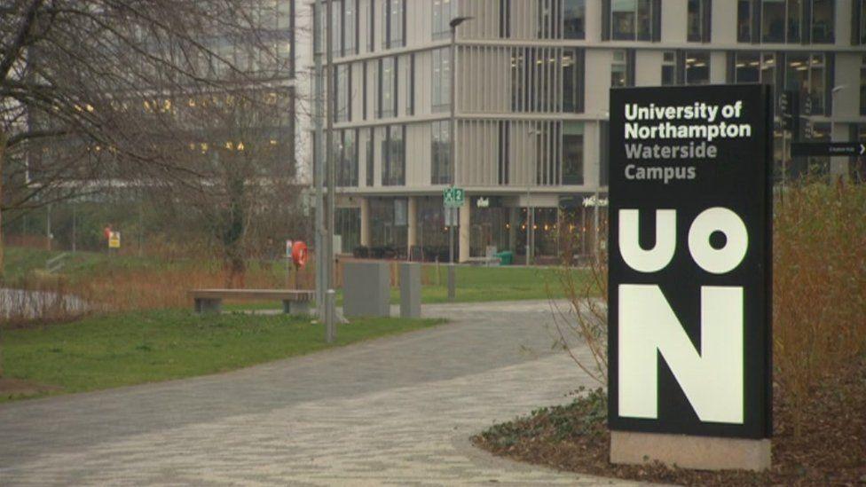 Entrance to modern Waterside Campus showing University logo