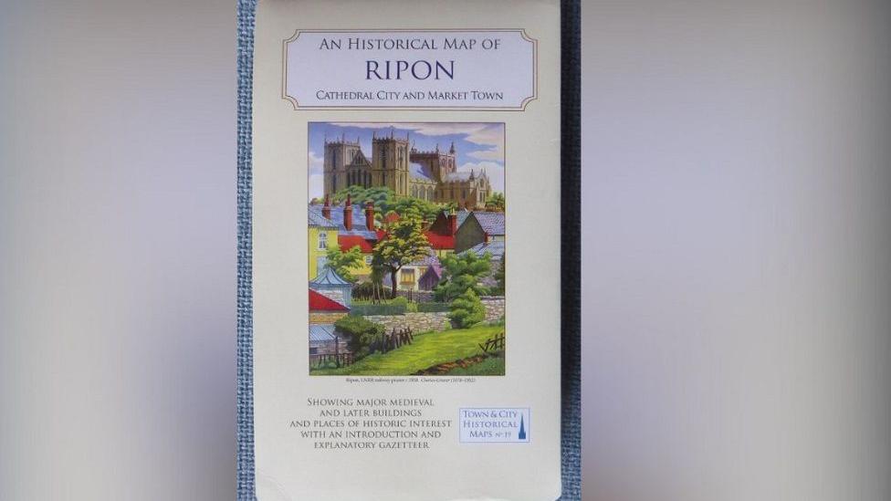 The front of the map, which is called "An Historical Map of Ripon", which has a drawing of the city including the cathedral and houses and river