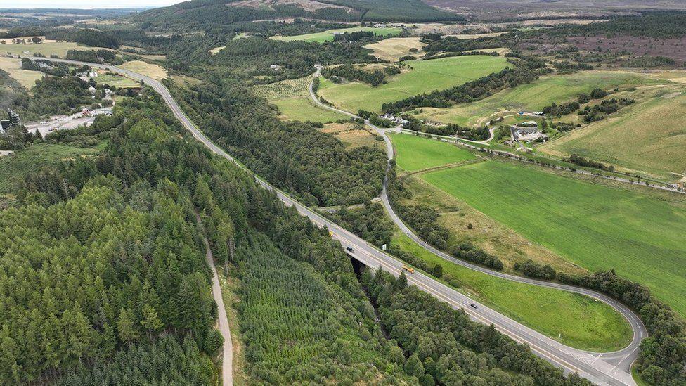 Aerial image showing a dualed section of the A9 snaking through a heavily wooded area