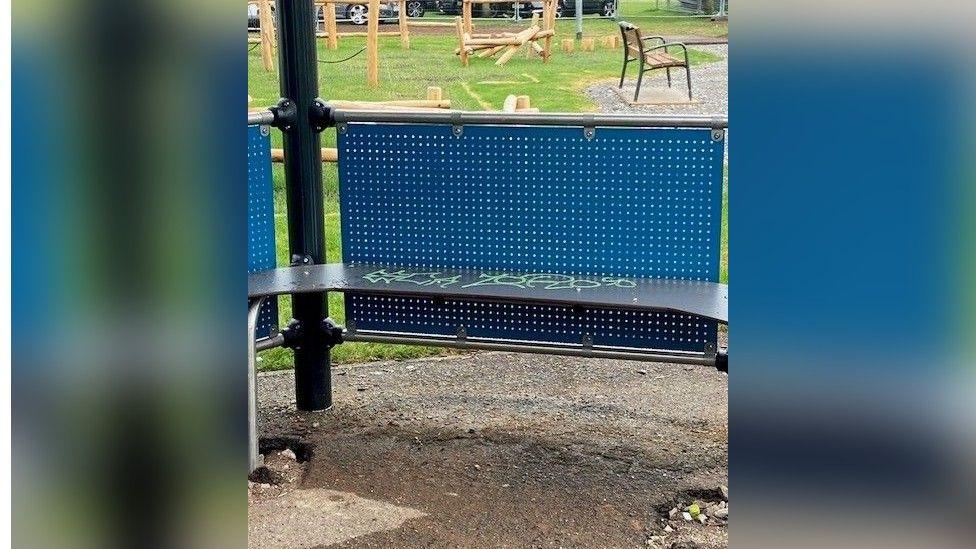 Vandalised bench on park