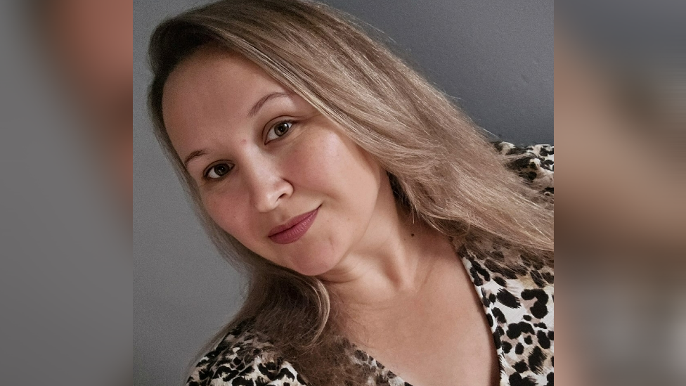 Women with long hair smiling at the camera in a selfie mode.