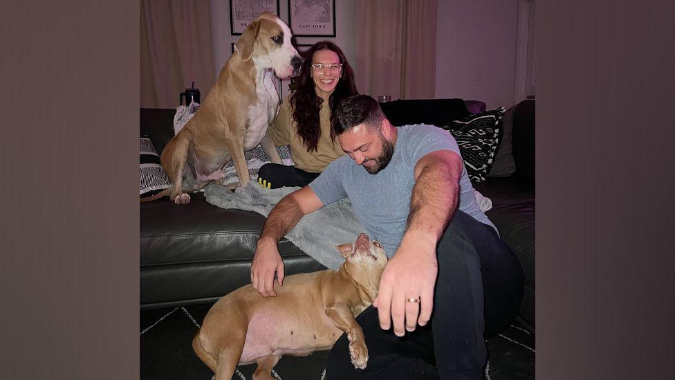 Chynna and Sterling Perkins with their two dogs