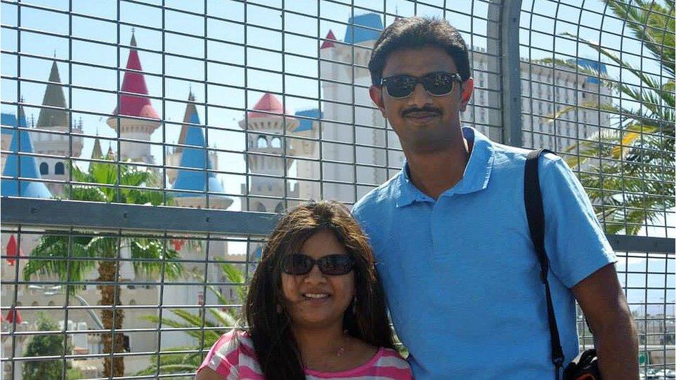 In this undated photo provided by Kranti Shalia, Srinivas Kuchibhotla, right, poses for photo with his wife Sunayana Dumala.