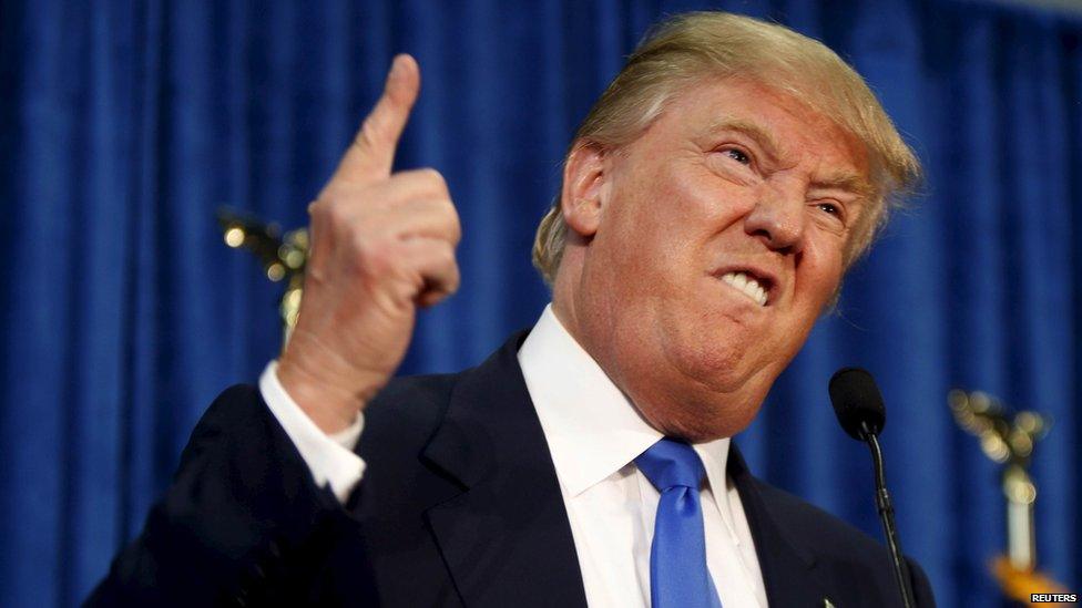 Republican presidential candidate Donald Trump gestures and declares "You"re fired!" at a rally in Manchester, New Hampshire, in this June 17, 2015 file photo.